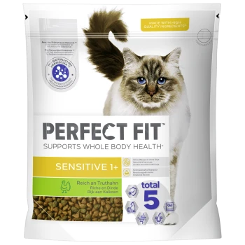 Katzennahrungsverpackung mit einer flauschigen blauäugigen Katze, beschriftet mit "Perfekte Passform", "Unterstützt die Gesundheit des gesamten Körpers", "Sensibel 1+" und "Reich an Truthahn."