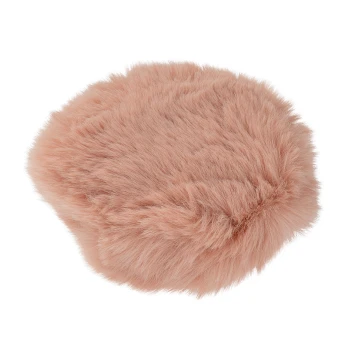 Lit rond pour animaux de compagnie en couleur rose doux, avec une texture pelucheuse idéale pour que les petits animaux se reposent confortablement.