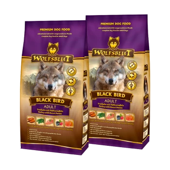 Emballage de nourriture pour chiens premium pour 'Wolfsblut Black Bird', présentant une image de loup, avec un texte indiquant des ingrédients de dinde et de patate douce.