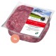 Rohes Geflügel-Hundefutter in einem klaren Behälter, beschriftet mit "proCani buy nature," mit pinkem Fleisch und "Geflügel komplett."