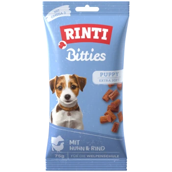 Blaues RINTI Bitties Welpen‑Leckerli‑Pack, Hundillustration und Kroketten; Text „PUPPY EXTRA SOFT“, „MIT HUHN & RIND“, „75 g“