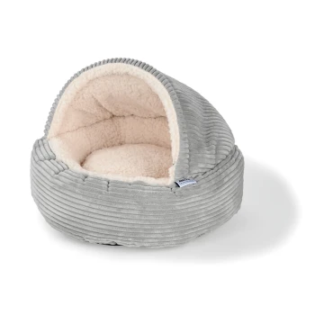 Gemütliches graues Haustierbett mit einem weichen, plüschigen Innenraum, ausgestattet mit einer abgerundeten Form und einem gerippten Außendesign.