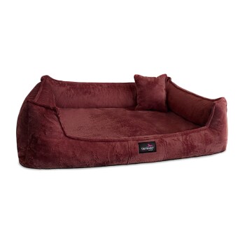 Ein plüschiges, burgunderfarbenes Haustierbett mit erhöhten Seiten und einem passenden kleinen Kissen, mit einem schwarzen Etikett, das "tierlando" liest.