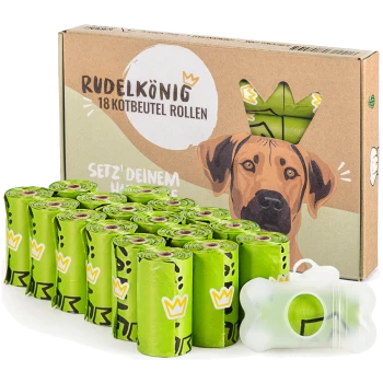 Grüne kompostierbare Kotbeutel in Rollen, verpackt in einer Pappschachtel mit der Aufschrift "RudelKönig POOP BAGS", mit einem knochenförmigen Spender.