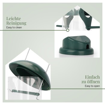 Grüne durchsichtige Futterröhre mit Sitzstange; Text: „Leichte Reinigung / Easy to clean“; „Einfach zu öffnen / Easy to open“.