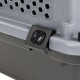 Close-up of a pet carrier featuring a gray plastic body, hexagonal ventilation holes, and a secure black latch.