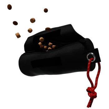 Eine schwarze Leckerlitasche für Haustiere mit einem roten Kordelzug, die kleine braune Kibble-Stücke vor einem weißen Hintergrund ausspuckt.
