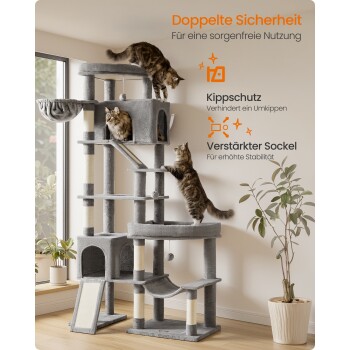 Grauer mehrstöckiger Kratzbaum mit drei Katzen in einem hellen Raum; sichtbarer deutscher Text: „Doppelte Sicherheit“, „Kippschutz“, „Verstärkter Sockel“.
