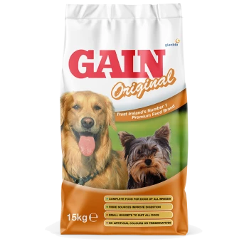 A 15kg bag of GAIN Original dog food featuring a golden retriever and a Yorkshire terrier on the front, with text highlighting its benefits.