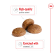 Three round pet food kibble pieces with text highlighting "High-quality protein content" and "Enriched with vitamins C & E."