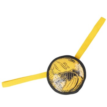 Yellow and black dog tug toy with two handles, circular center with textured surface, on white background.