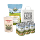 Haustierfutterprodukte: BELLFOR Leckerlis, SHIIMUN SLIM Paket, FREILAND-MENÜ Huhn Dosen und eine Tragetasche mit der Aufschrift "HUNDE LIEB HABER".
