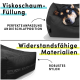 Hund ruht auf einem schwarzen Haustierbett mit viskoelastischem Schaumstoff, mit Text über die perfekte Anpassung der Schlafposition und langlebigen Materialien.