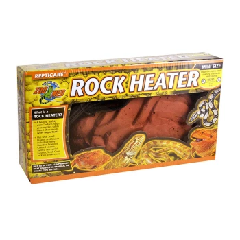 Verpacktes Reptilienzubehör, beschriftet mit "Rock Heater", mit Bildern verschiedener Reptilien, einschließlich eines Bartagamen und Schlangen, und Text, der seine Verwendung erklärt.