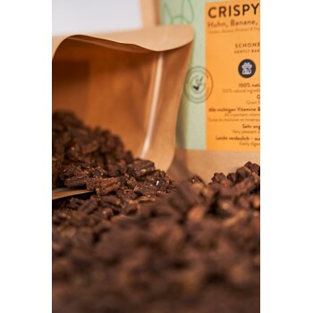 Knusprige Haustierleckerlis in einer braunen Papiertüte, mit Stücken beschriftet "Huhn, Banane" und Text, der natürliche Zutaten und Vitamine hervorhebt.