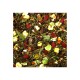 A close-up of a colorful mix of dried herbs, seeds, and vegetables, including yellow corn, red berries, and green leaves, ideal for pet food.