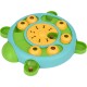 A colorful interactive pet puzzle toy shaped like a turtle, featuring yellow and green compartments for hiding treats.