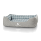 Graues Hundebett mit einem blau-weißen Karomuster, mit dem Logo "KNUFFELWUFFF" auf der Vorderseite.