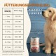 Golden-Retriever-Welpe neben Wildfang 'Lamm Pur'-Dose und Fütterungstabelle mit Beschriftung 'Fütterungsempfehlung' PUPPY/JUNIOR.