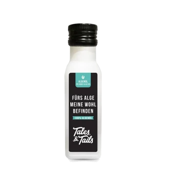 Weiße Flasche Tales & Tails Algenöl für Hunde und Katzen mit schwarzem Etikett und schwarzem Verschluss, Text auf Deutsch.