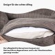 Nahaufnahme eines Haustierbettes mit abnehmbarem, maschinenwaschbarem Bezug aus strukturiertem braunem Stoff. Deutscher Text hebt einfache Pflege und Bequemlichkeit hervor.