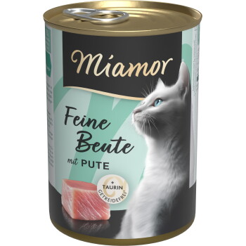 Puszka karmy Miamor z profilem białego kota, surowym kawałkiem indyka i widocznym napisem 'Feine Beute mit PUTE' oraz '+TAURIN GETREIDEFREI'.