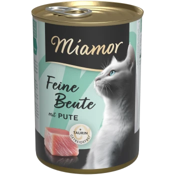 Boîte de nourriture pour chat Miamor avec profil de chat blanc, morceau de dinde crue et textes visibles 'Feine Beute mit PUTE' et '+TAURIN GETREIDEFREI'.