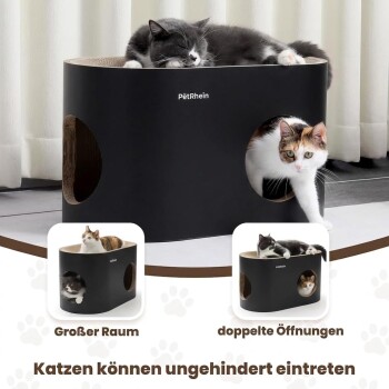 Schwarzes PetRhein-Katzenbett auf Teppich mit einer schwarzen Katze, die oben liegt, und einer schwarz-weißen Katze, die durch ein seitliches Loch schaut.