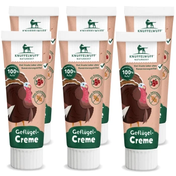 Sechs Tuben Knuffelwuff Geflügel-Creme mit Truthahn-Illustration, beschriftet "100% Pute," ohne Konservierungsstoffe und mit Cranberry.