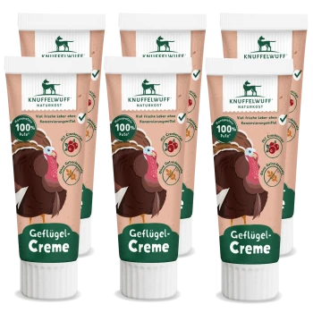 Sechs Tuben Knuffelwuff Geflügel-Creme mit Truthahn-Illustration, beschriftet "100% Pute," ohne Konservierungsstoffe und mit Cranberry.