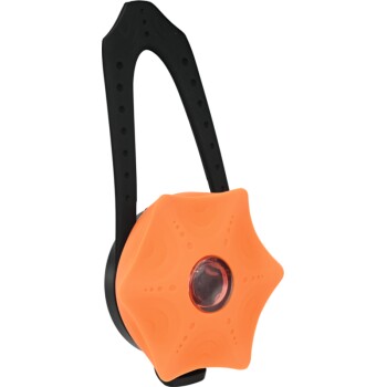 Jouet pour animaux de compagnie en forme d'étoile orange avec une poignée noire, conçu pour le jeu interactif.