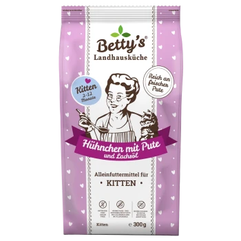 Betty's Landhausküche lila Kittenfutter-Tüte mit Herzchen, Illustration einer Frau, die eine Katze hält; sichtbarer Text 'Hühnchen mit Pute', 'Kitten 2–12 Monate', '300 g'.