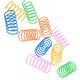 Colorful pet toy springs in various sizes and colors, including blue, green, orange, yellow, and pink, scattered on a white background.