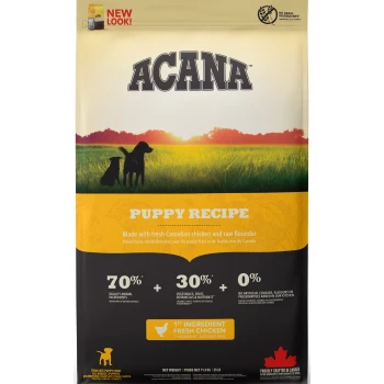 ACANA Puppy Recipe bag with two dogs in a sunset field. Highlights: "70% animal ingredients," "30% veggies," "0% artificial additives."