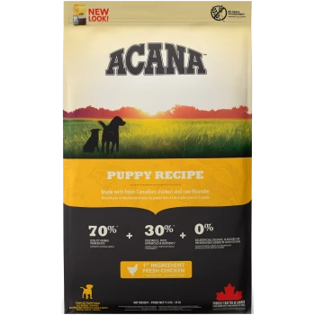 ACANA Puppy Recipe bag with two dogs in a sunset field. Highlights: "70% animal ingredients," "30% veggies," "0% artificial additives."