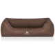 Braunes Hundebett mit einem gerippten Innenraum und einer glatten Außenseite, mit dem Logo "Knuffelwuff" auf der Vorderseite.