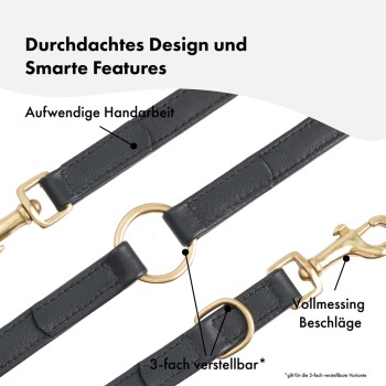 Schwarze Leder-Hundeleine mit goldenen Beschlägen, mit verstellbarer Länge und detaillierter Verarbeitung. Text hebt Designmerkmale hervor.