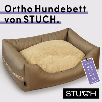 Orthopädisches Hundebett von STUCH, mit einem weichen beigen Kissen und einem Etikett, das "PETA Approved VEGAN" angibt.
