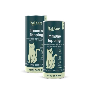 Zwei türkisfarbene KatKare 'Immuno Topping'-Dosen mit Katzenillustration; sichtbarer Text 'Vital-Topping'.