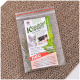 Verpackung des Katzenspielzeugs "Knuddel Kissen" mit einem verspielten Kätzchen und einer schwarzen Katze, mit Text auf Deutsch über das Produkt und Unternehmensdetails.