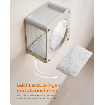 Wandmontiertes Haustierbett mit einem weichen Kissen, kreisförmiger Öffnung und dem Text 'Leicht anzubringen und abzunehmen'.