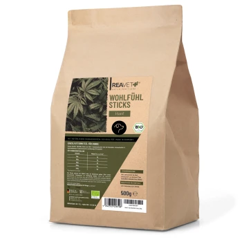 Braune Papiertüte mit "Wohlfühl Sticks" für Hunde, hergestellt aus Hanf, mit einem grünen Etikett mit Nährwertangaben und einer Bio-Zertifizierung.