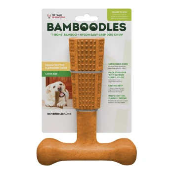 Peanut butter flavored dog chew toy in T-bone shape, featuring bamboo and nylon materials, with text highlighting durability and dental benefits.