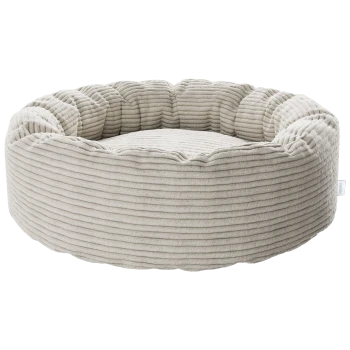 Rundes beiges Hundebett im Donut-Stil aus geripptem Cordstoff mit erhöhten Seitenwällen und gepolstertem Zentrum.