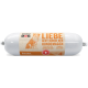Emballage cylindrique de nourriture pour chiens étiqueté "natura DOG" avec un dessin de chien et le texte : "LIEBE GEHT DURCH DEN HUNDMAGEN" et "Poulet mit Reis Terrine."