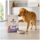 Golden Retriever schnüffelt an einer Tüte Select Gold MEDICA Veterinary Diet Hundefutter neben einem leeren Napf in einer Küche.