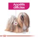 Illustration d'un chien duveteux avec un pelage long et fluide, étiqueté "Appétits difficiles" en texte rose gras.