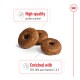Three round, brown dog treats with a hole in the center, labeled "High-quality protein content" and "Enriched with EPA, DHA and vitamins C & E."