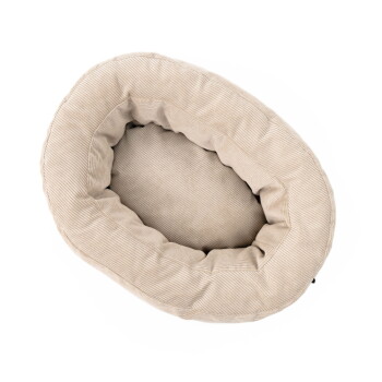 Draufsicht auf ein beiges Cord-Oval-Katzenbett mit erhöhtem Rand und gerippter Textur.