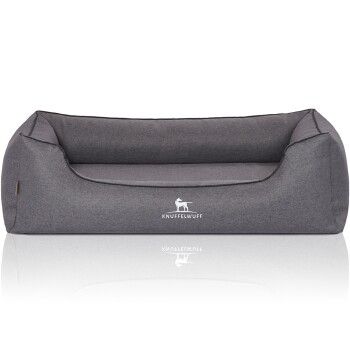 Graues Haustierbett mit erhöhten Rändern und einem weichen Innenraum, mit dem Logo "KNUFFELWUFF" auf der Vorderseite gestickt.